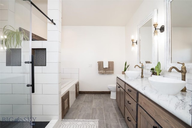 18287 Haasakker Rd, Three Forks, MT 59752 - full bathroom featuring double vanity, a garden tub, and a shower stall