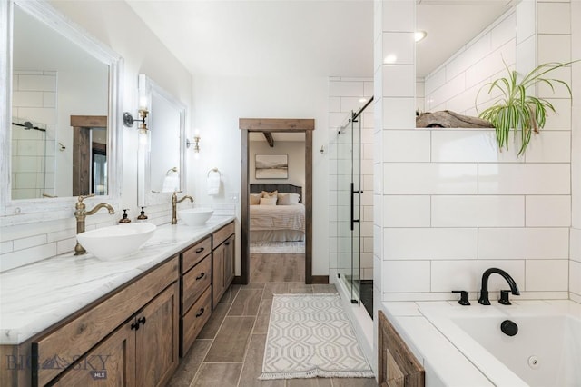18287 Haasakker Rd, Three Forks, MT 59752 - full bath with a whirlpool tub, double vanity, a shower stall, and tile patterned floors