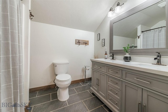 18287 Haasakker Rd, Three Forks, MT 59752 - bathroom with lofted ceiling, double vanity, and tile patterned flooring