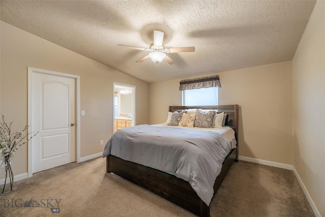 18287 Haasakker Rd, Three Forks, MT 59752 - carpeted bedroom with a textured ceiling, lofted ceiling, connected bathroom, and ceiling fan