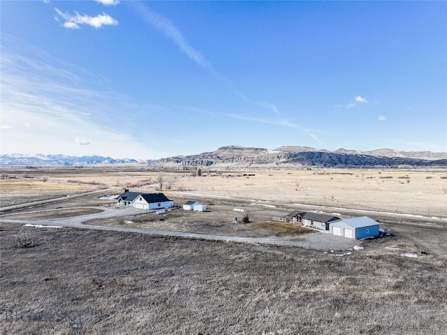 18287 Haasakker Rd, Three Forks, MT 59752 - view of yard featuring a mountain view, an outdoor structure, and a view of countryside
