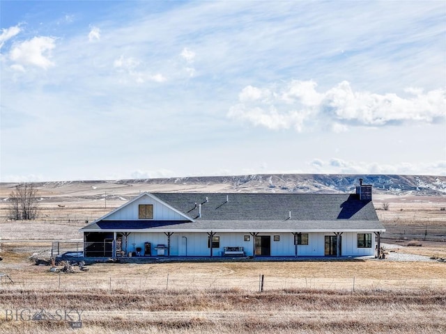 18287 Haasakker Rd, Three Forks, MT 59752 - back of house featuring a chimney and roof with shingles
