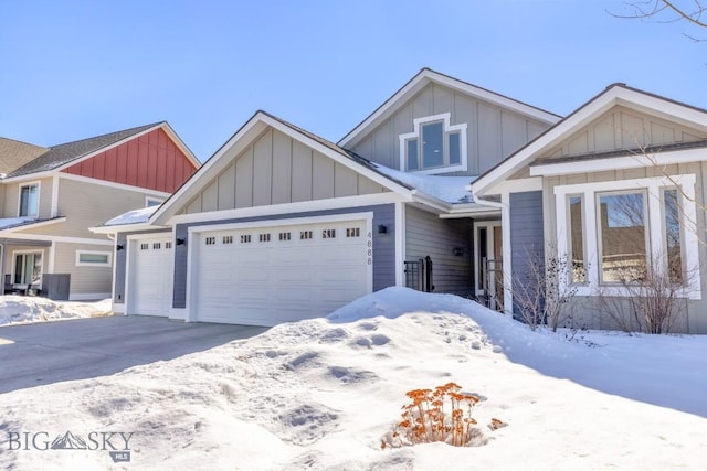 view of front of home featuring board and batten siding, concrete driveway, and a garage