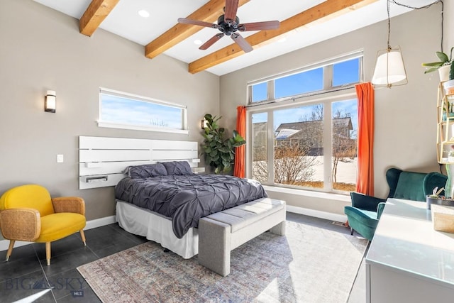 bedroom with beam ceiling, multiple windows, and baseboards