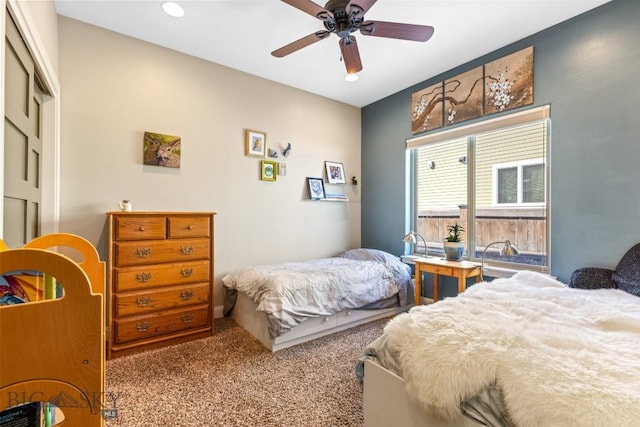 bedroom featuring carpet flooring, a closet, and ceiling fan