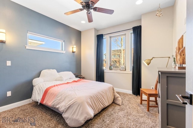 bedroom featuring multiple windows, baseboards, and carpet