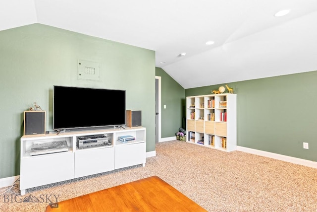 unfurnished living room with recessed lighting, light colored carpet, baseboards, and vaulted ceiling