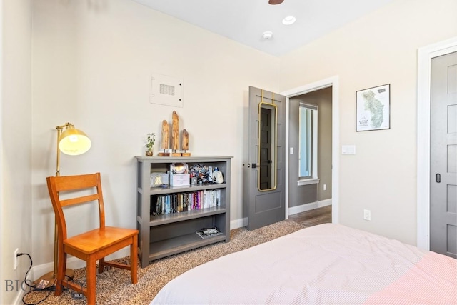 bedroom with carpet flooring and baseboards