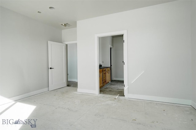 unfurnished bedroom featuring visible vents and baseboards