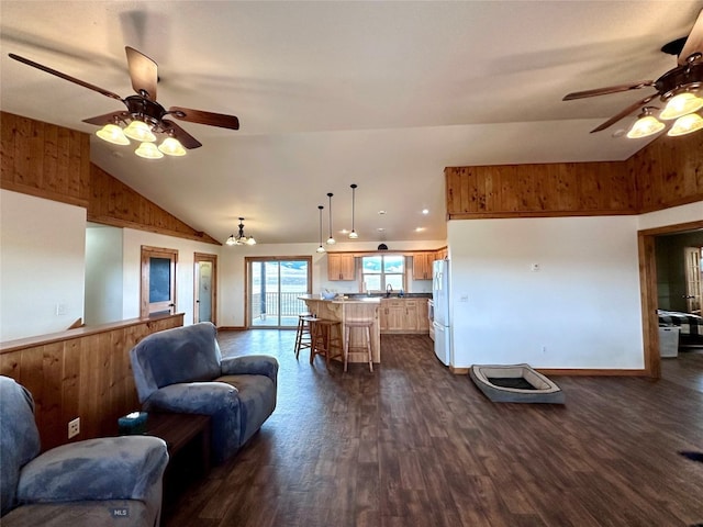 living room with vaulted ceiling, dark wood-style floors, and ceiling fan