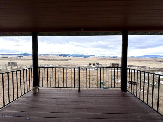 deck featuring a mountain view and a rural view