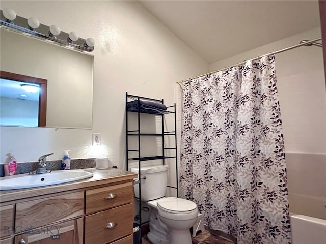 bathroom with vanity, toilet, and shower / bath combo