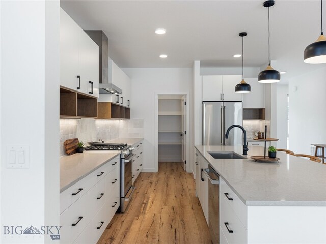 2824 S 30th Ave, Bozeman, MT 59718 - kitchen featuring stainless steel appliances, a sink, a kitchen island with sink, decorative backsplash, and recessed lighting