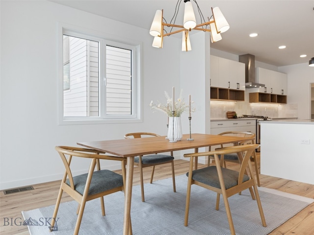 2824 S 30th Ave, Bozeman, MT 59718 - dining room with light wood-style flooring, a chandelier, recessed lighting, and baseboards