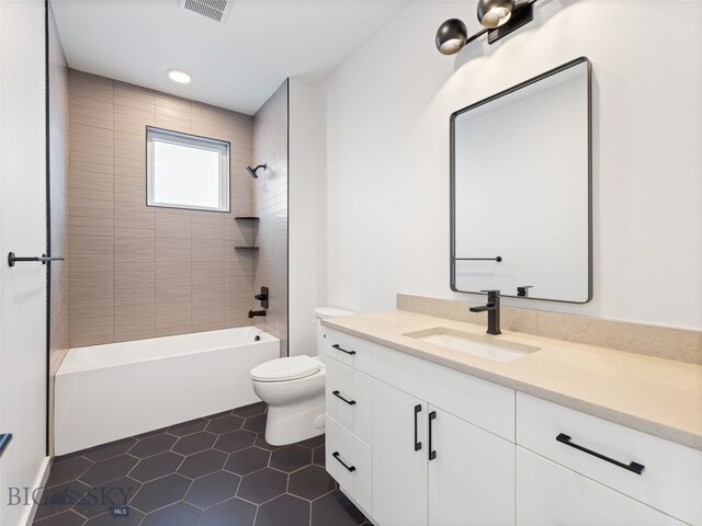 2824 S 30th Ave, Bozeman, MT 59718 - bathroom with vanity, toilet, shower / tub combination, and tile patterned flooring