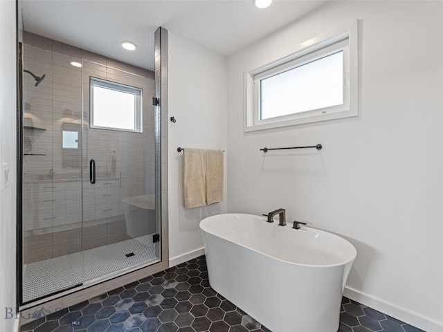 2824 S 30th Ave, Bozeman, MT 59718 - bathroom featuring baseboards, a freestanding tub, healthy amount of natural light, a stall shower, and recessed lighting