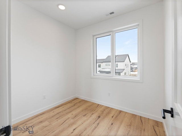 2824 S 30th Ave, Bozeman, MT 59718 - unfurnished room featuring baseboards, wood finished floors, and recessed lighting