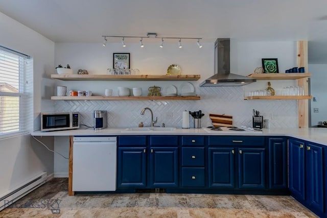 kitchen with white appliances, open shelves, blue cabinetry, a sink, and wall chimney exhaust hood