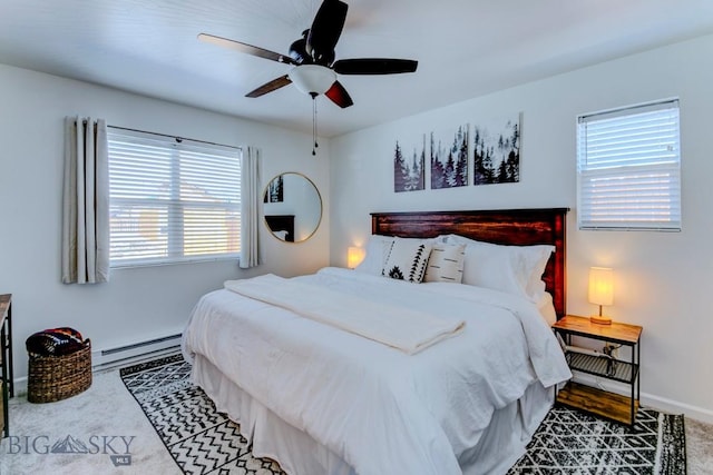 bedroom featuring baseboards, carpet floors, baseboard heating, and ceiling fan