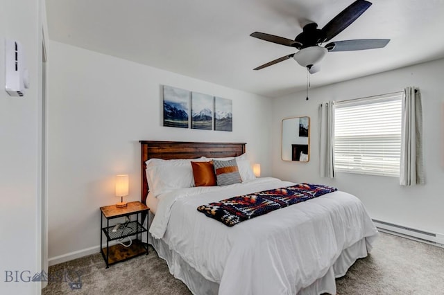 carpeted bedroom featuring a ceiling fan, baseboards, and baseboard heating