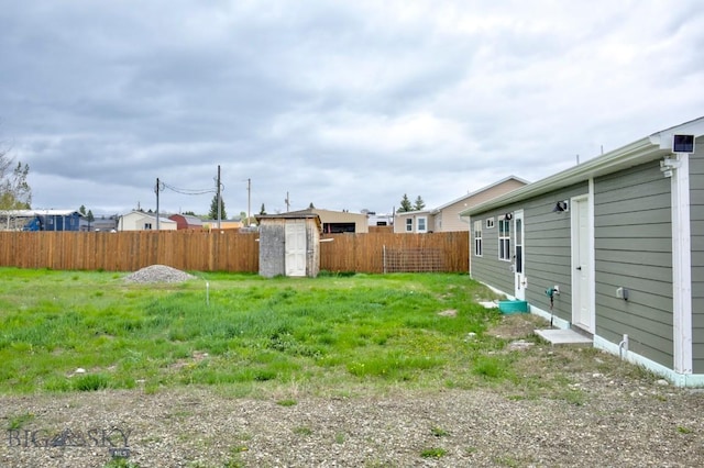 305 Lathrop St W, Clyde Park, MT 59018 - fenced backyard featuring a storage shed and an outbuilding
