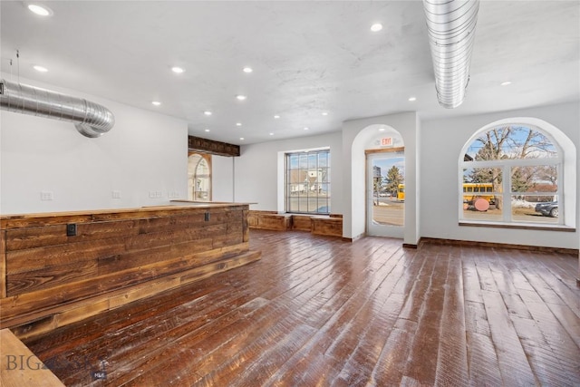 bar with recessed lighting and wood-type flooring