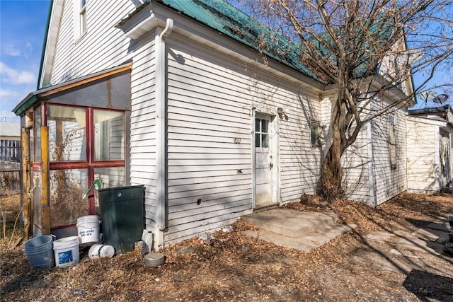 exterior space with metal roof