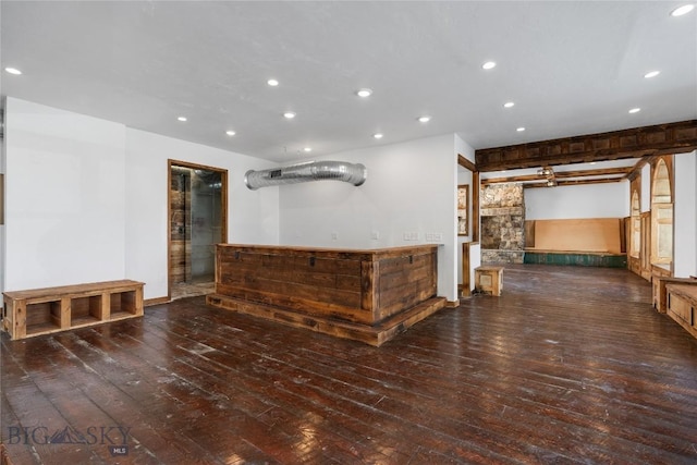 bar featuring hardwood / wood-style floors, a bar, and recessed lighting