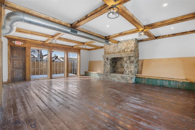 unfurnished living room featuring hardwood / wood-style flooring, beamed ceiling, a fireplace, and coffered ceiling