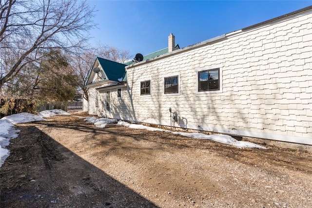 view of side of property with a chimney