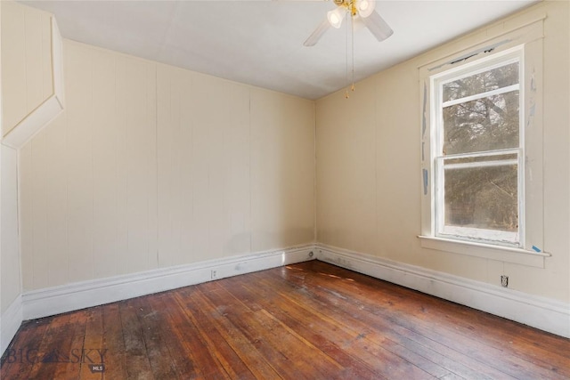 spare room with a ceiling fan and hardwood / wood-style floors