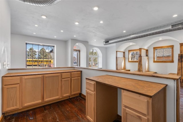 kitchen featuring dark wood-type flooring, recessed lighting, and visible vents