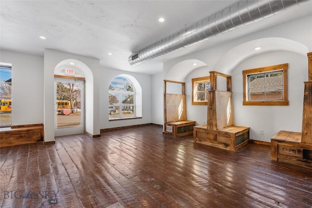 interior space with recessed lighting, baseboards, and hardwood / wood-style floors