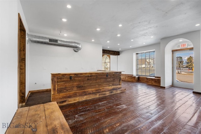 bar with recessed lighting, baseboards, and hardwood / wood-style flooring