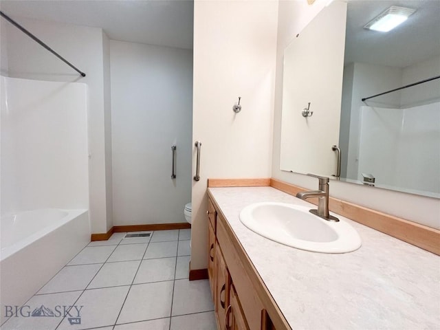 full bathroom with tile patterned flooring, baseboards, toilet, shower / bathtub combination, and vanity