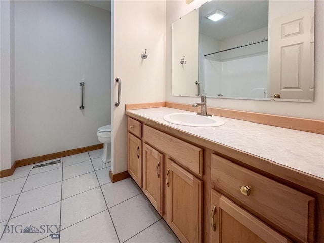 bathroom with tile patterned floors, visible vents, toilet, baseboards, and vanity