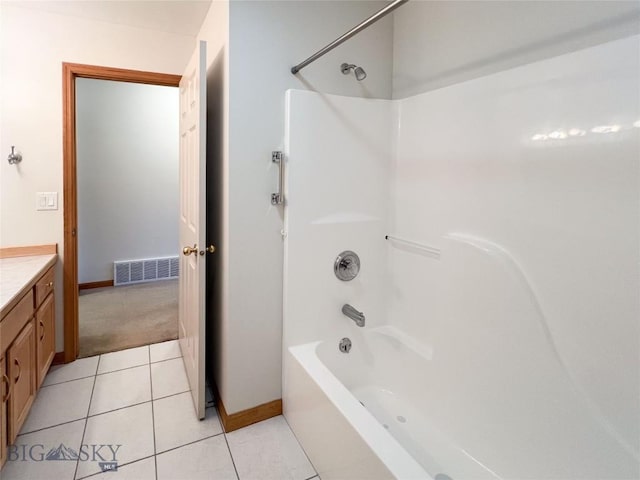 full bathroom with visible vents, tile patterned flooring, baseboards, bathing tub / shower combination, and vanity