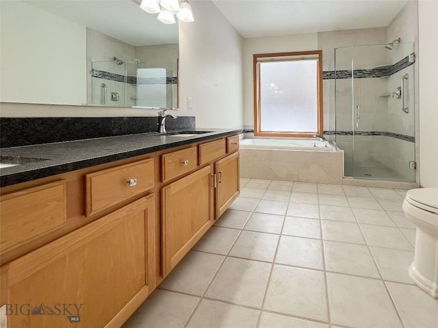 full bath featuring vanity, a bath, a shower stall, and tile patterned flooring