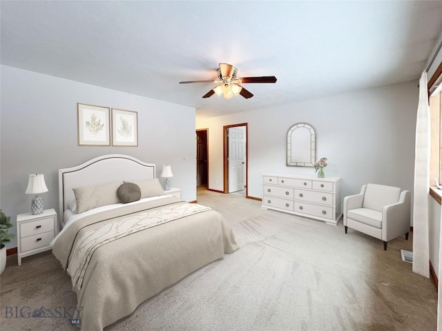 bedroom featuring light colored carpet and ceiling fan