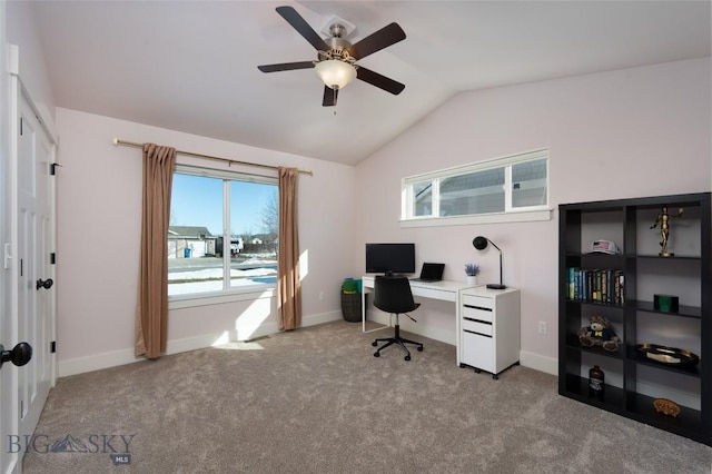 carpeted home office featuring ceiling fan, baseboards, and lofted ceiling