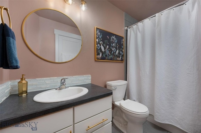 full bathroom with vanity, a shower with shower curtain, and toilet