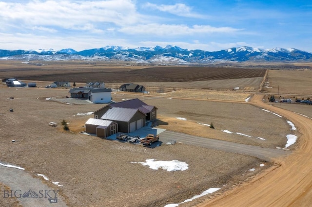 birds eye view of property featuring a rural view and a mountain view