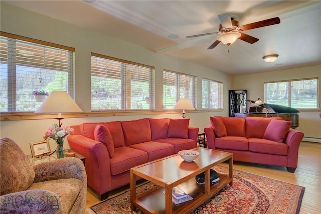 living room with a ceiling fan and light wood-style floors