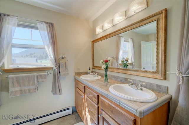 full bath featuring a baseboard heating unit, a wealth of natural light, and a sink