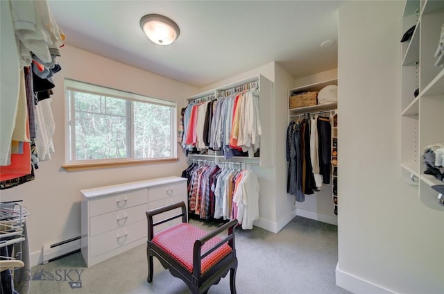 walk in closet featuring carpet flooring and a baseboard heating unit