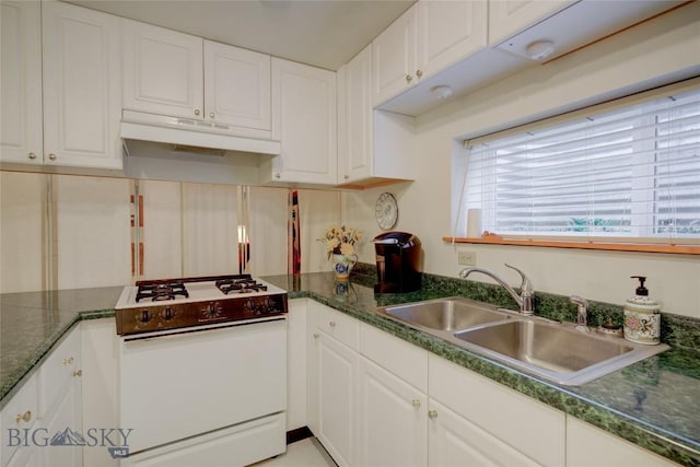 kitchen featuring under cabinet range hood, a sink, white cabinetry, and white gas range oven