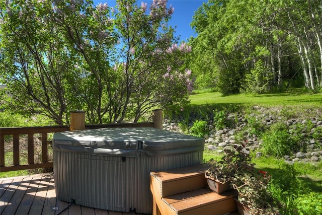 wooden terrace with a hot tub