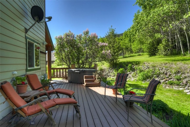 wooden deck with a hot tub