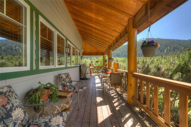 wooden terrace with a forest view