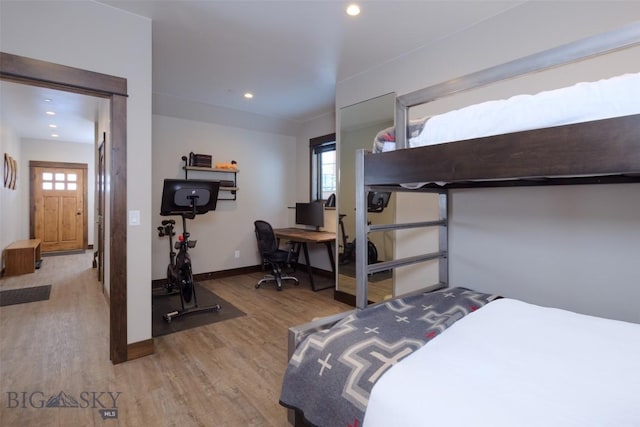 bedroom featuring recessed lighting, wood finished floors, and baseboards